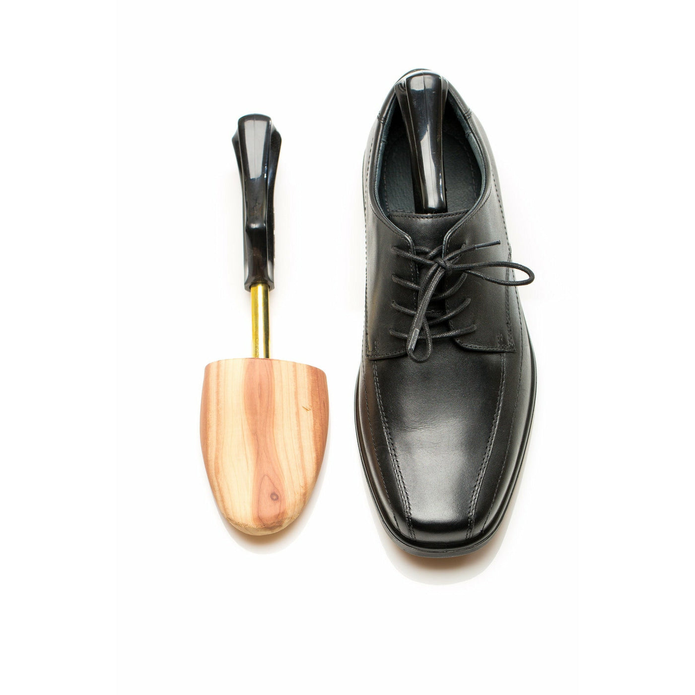 Overview of Cedar Shoe Tree Alongside Leather Dress Shoe